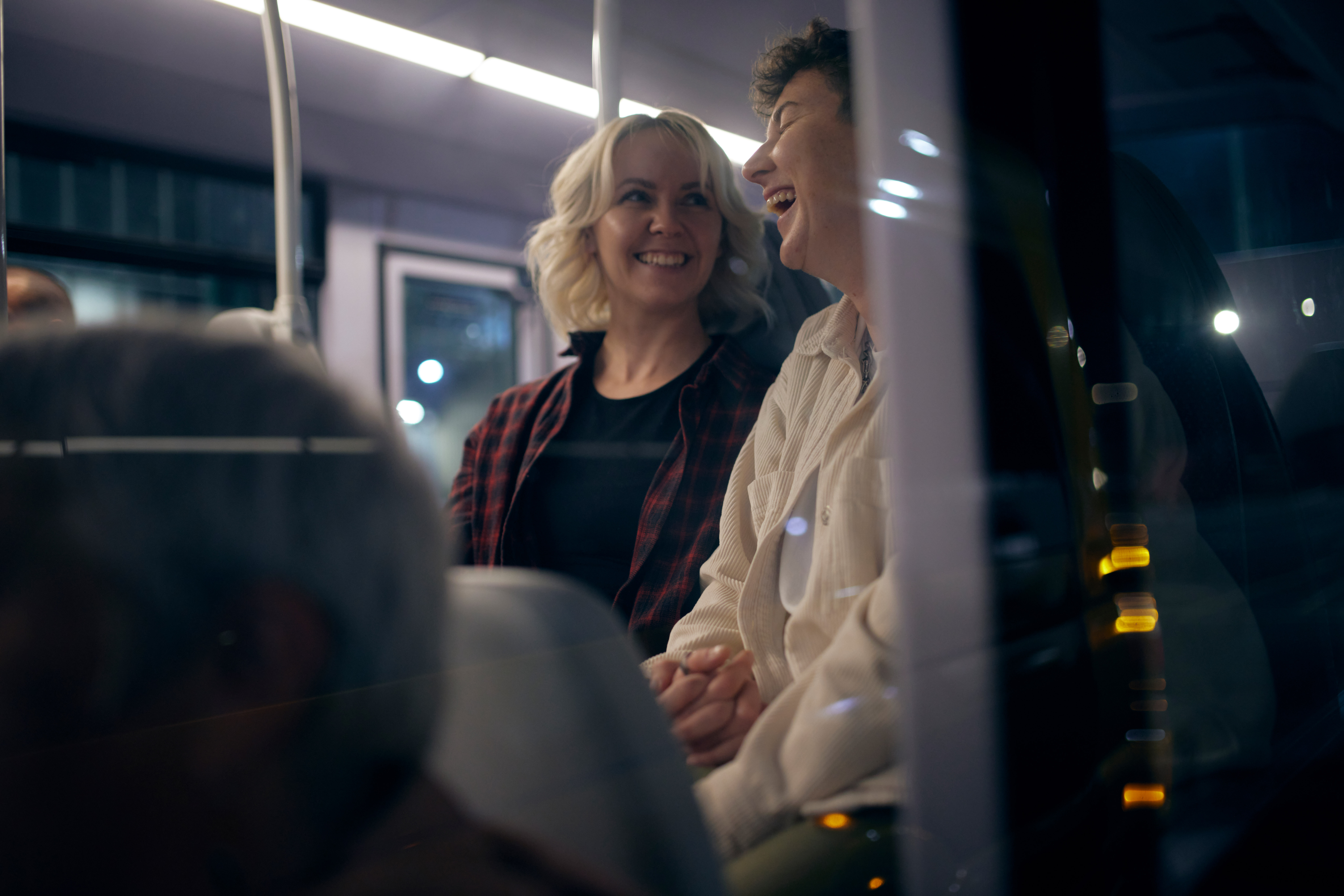 Passengers laughing and smiling on board