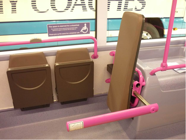 Wheelchair arm within bus wheelchair bay