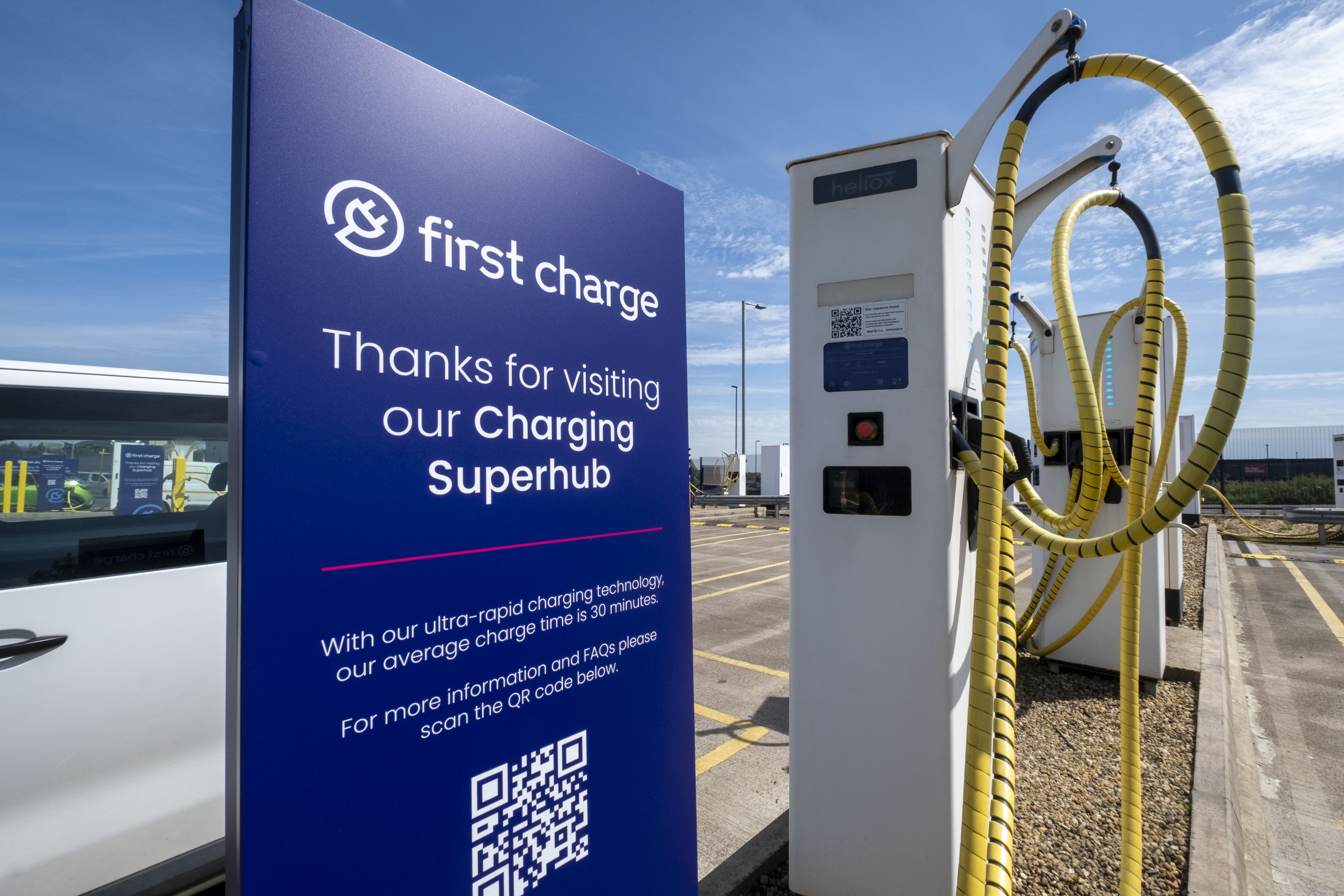 First charge sign alongside electric charging port