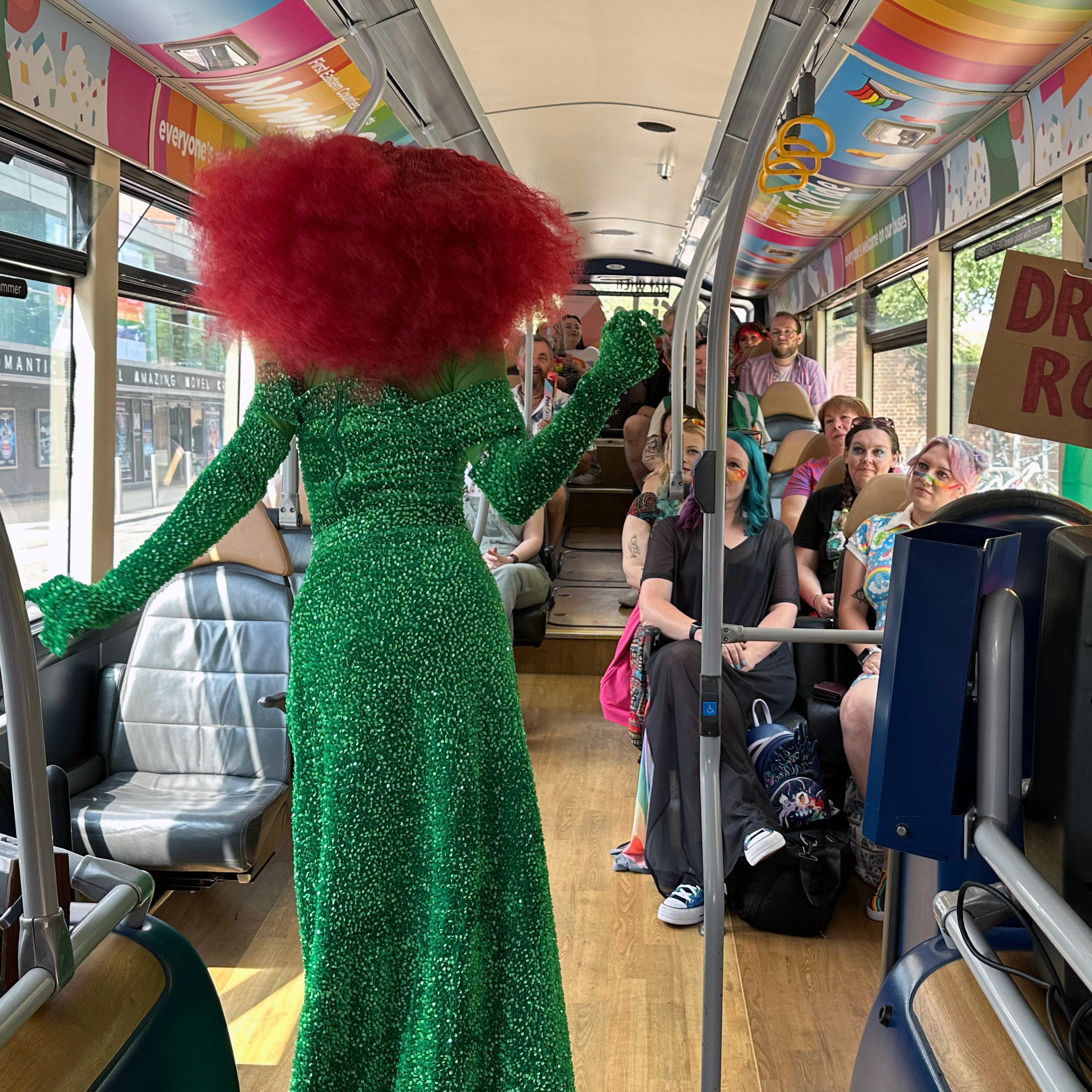 Drag queen Jester Mirage performing on-board the bus at the Norwich Pride event.