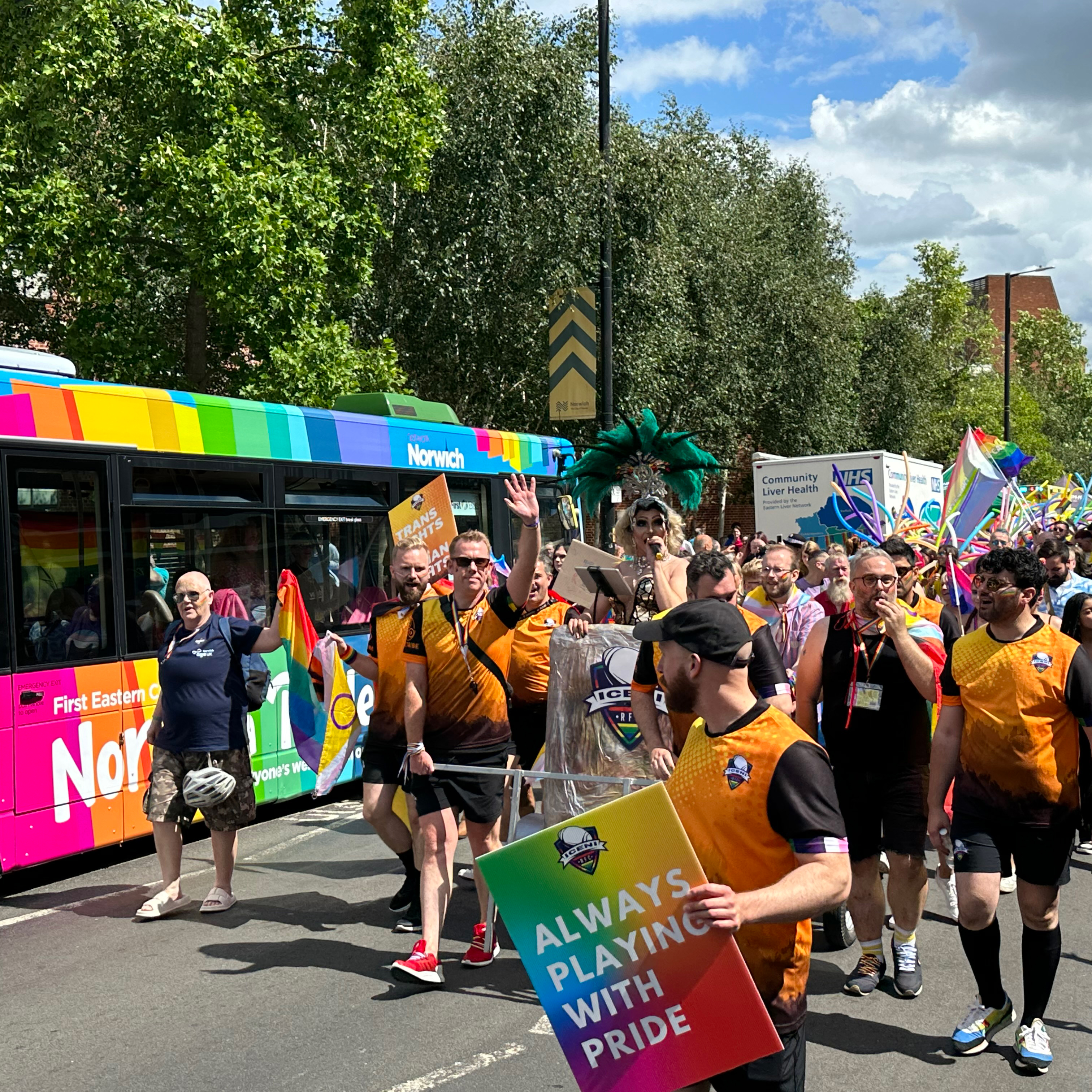 The pride march passing the pride bus at the Norwich Pride event.