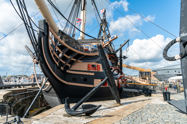 A historic naval boat docked in Portsmouth Harbour