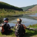 Glyncorrwg Ponds two people sat at Glyncorrwg Ponds Neath Port Talbot