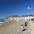 Aberystwyth Seafront people sitting on aberystwyth beach